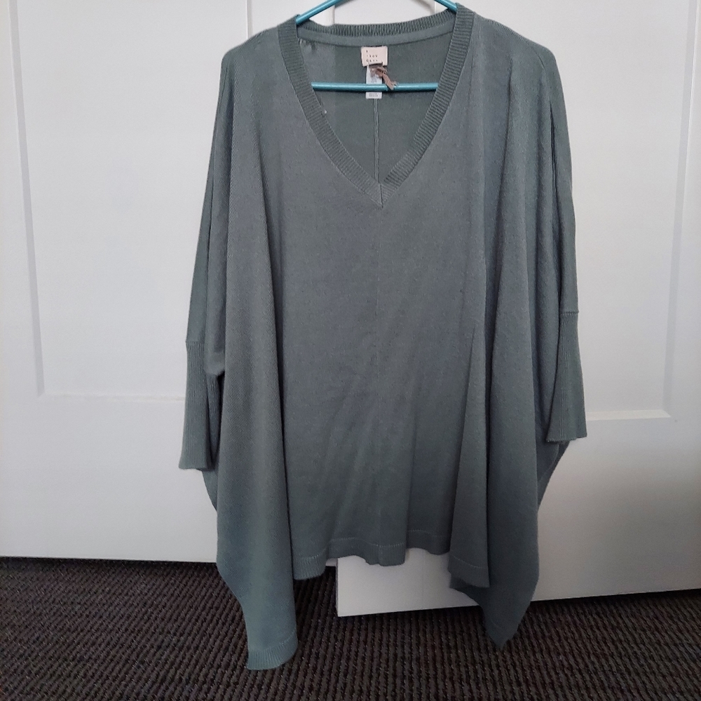 A new day one size fits most poncho